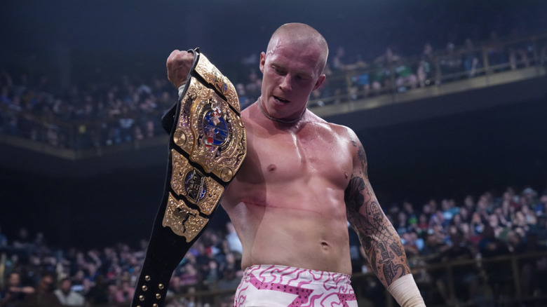 Fletcher looking at his International Championship belt