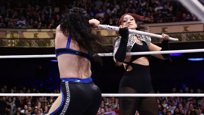 Statlander grabbing the kendo stick from Persephone