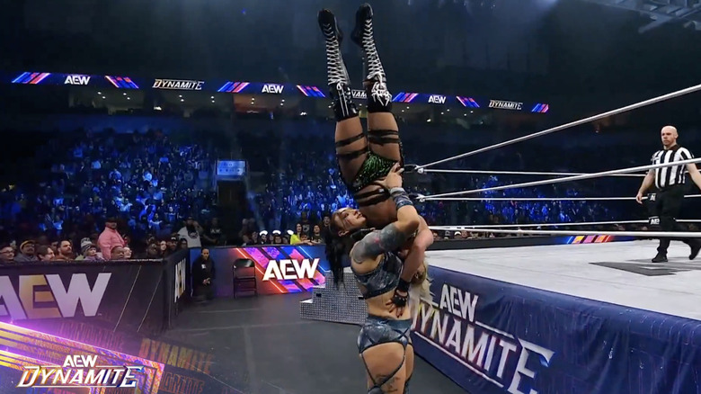 Statlander setting up for a delayed vertical suplex on Thekla