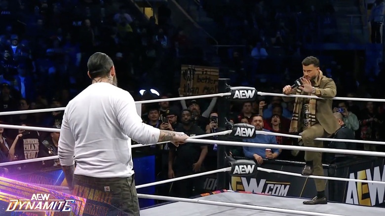 King and MJF staring one another down from opposite sides of the ring