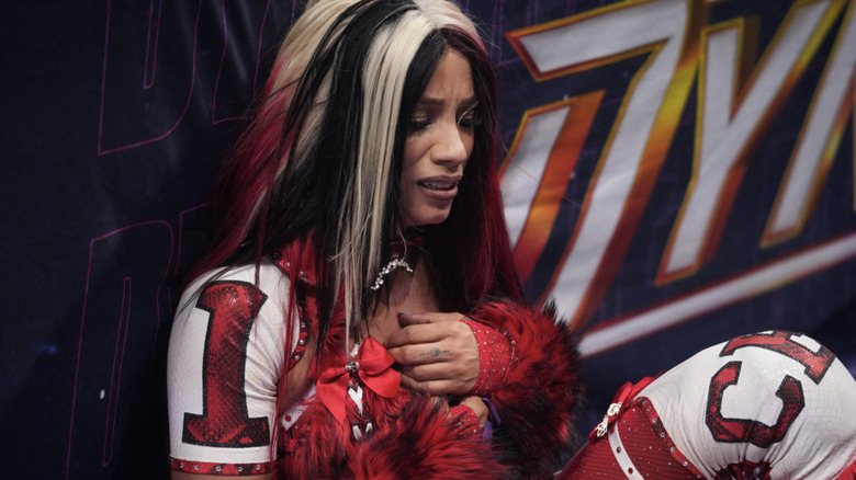 Mone on the outside of the ring