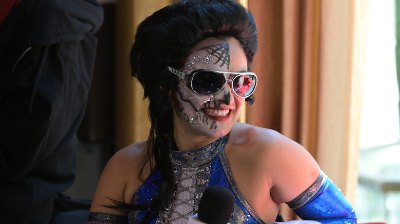 Thunder Rosa, dressed like Elvis Presley