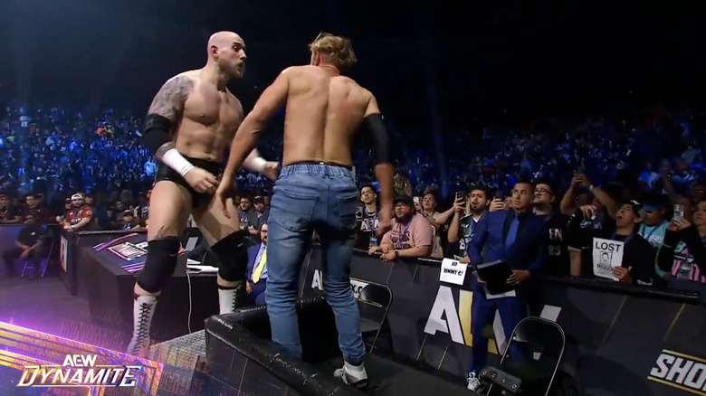 Kidd and Cassidy brawling near the timekeeper's area.