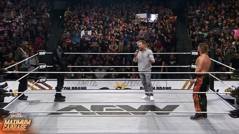 Strickland, Omega, and Page in the ring