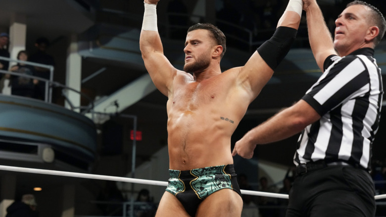 MJF with his hand raised in the ring