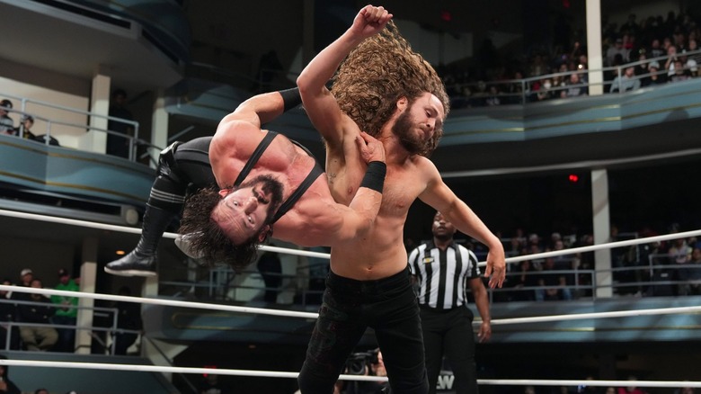 Jack Perry levels Pac with a lariat