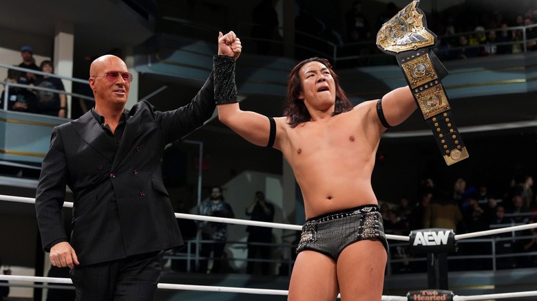 Don Callis celebrates with Konosuke Takeshita