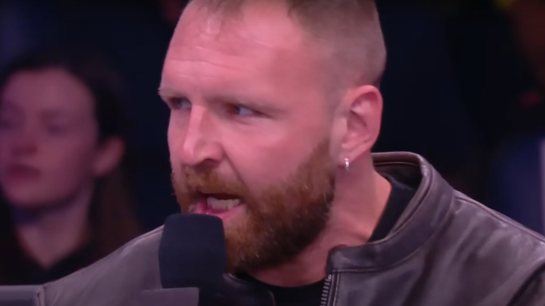 Jon Moxley talking into microphone