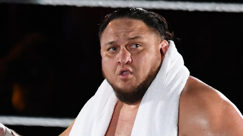 Samoa Joe with a towel on his shoulders