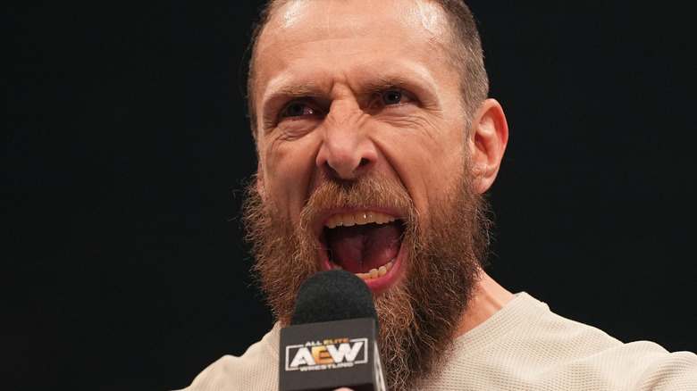 Bryan Danielson yelling into a microphone