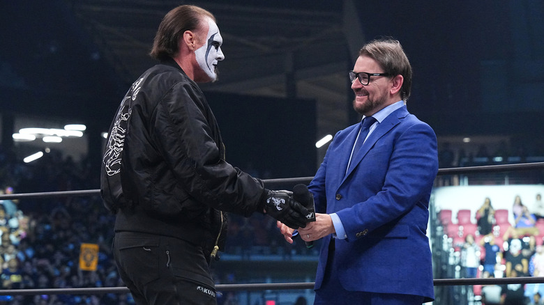 Sting and Tony Schiavone shake hands
