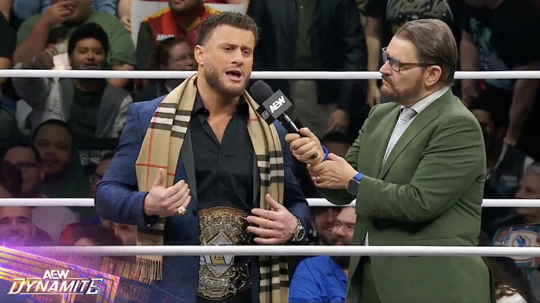 MJF speaking with Schiavone in the ring