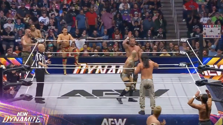 All eight men at ringside