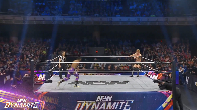 Knight and Okada inside the ring