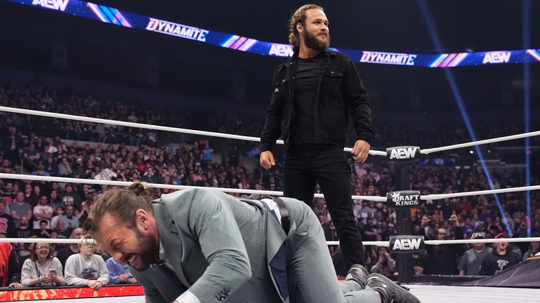 Jack Perry stands over a wounded Kenny Omega