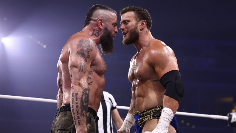 Briscoe and MJF staring down one another in the ring