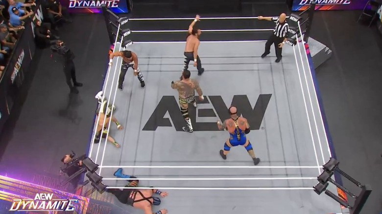 Several competitors inside the ring