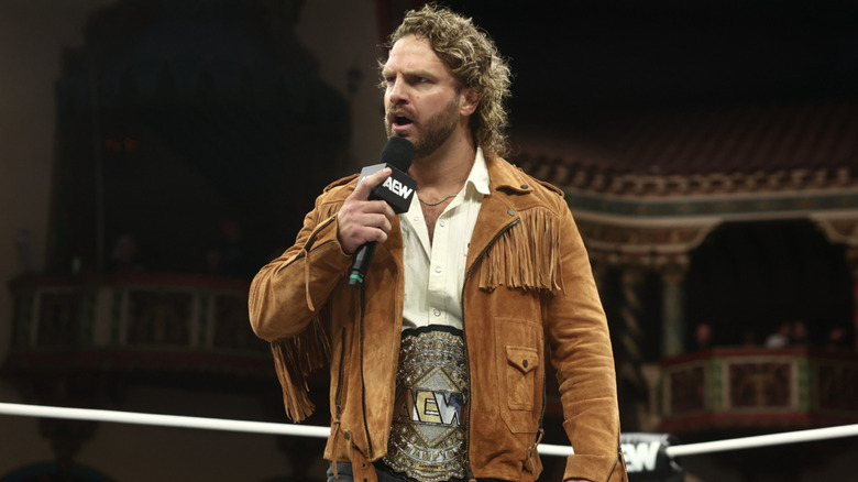 Page with his title speaking in the ring