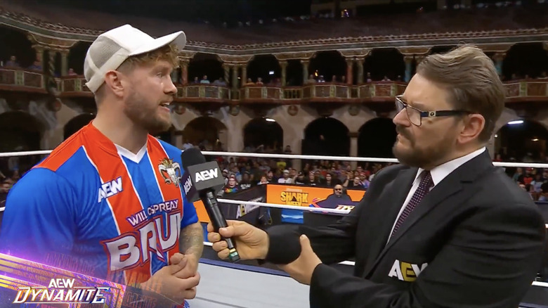 Ospreay and Schiavone speaking in the ring