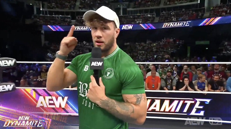 Ospreay speaking in the ring