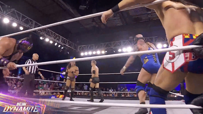 The Don Callis Family and Speedball in the ring