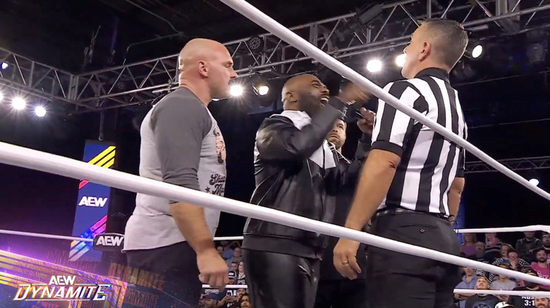 FTR chewing out Turner in the ring