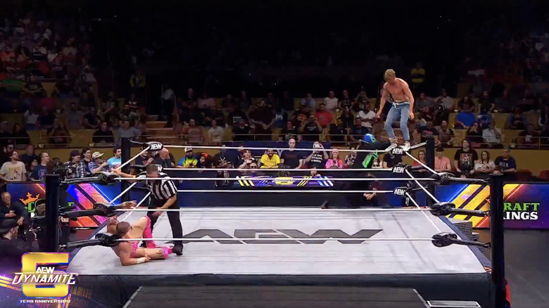 Cassidy ascending to the top rope as El Clon looks to push him off