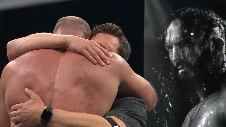 Bryan Danielson and Jon Moxley embrace