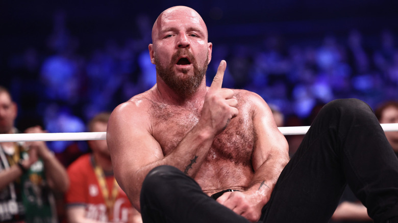 Moxley holding up a one as he's sitting inside the ring