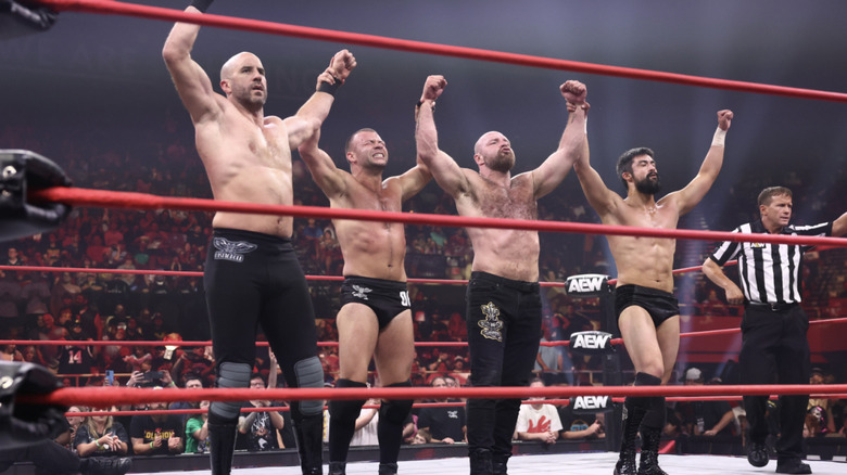 The Death Riders inside the ring celebrating a win