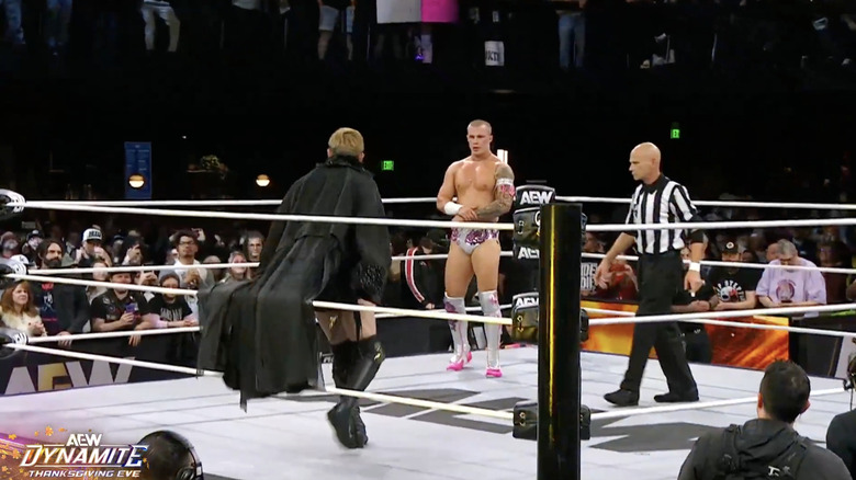 Okada and Fletcher staring one another down in the ring