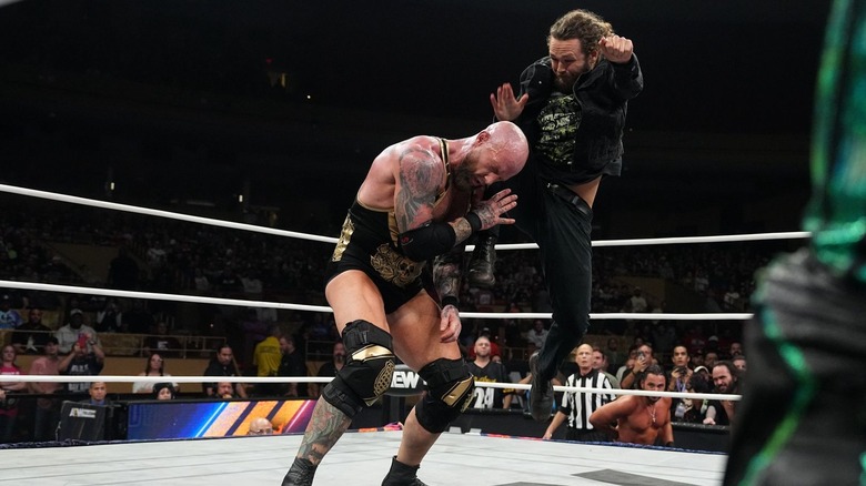 Jack Perry delivering a running knee to Josh Alexander