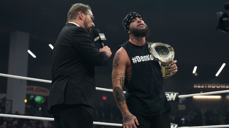Mark Briscoe grimaces as Tony Schiavone talks to him