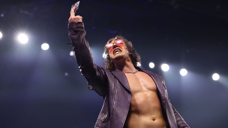 Ace Austin shows off a card
