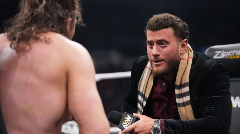 MJF looks smugly at Kenny Omega