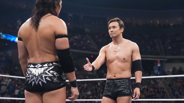 Kazuchika Okada offers a handshake to Konosuke Takeshita