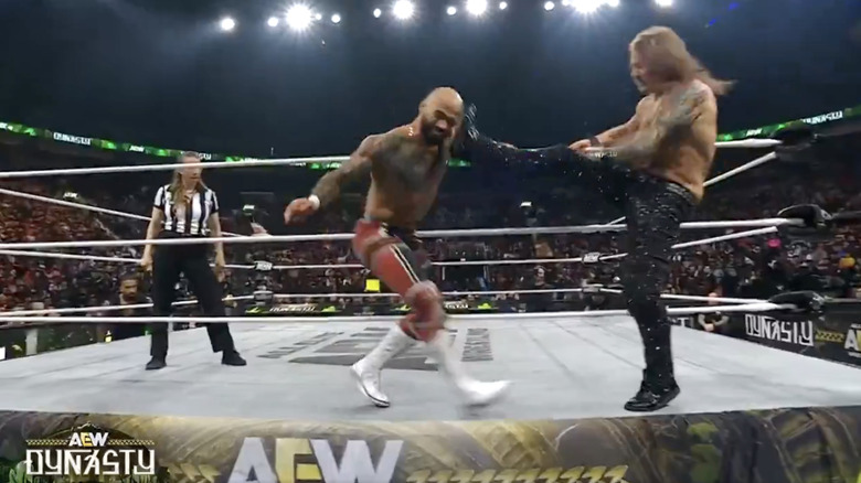 Ricochet and Jericho on the ring apron