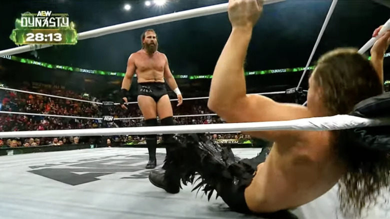 Davis standing over Perry