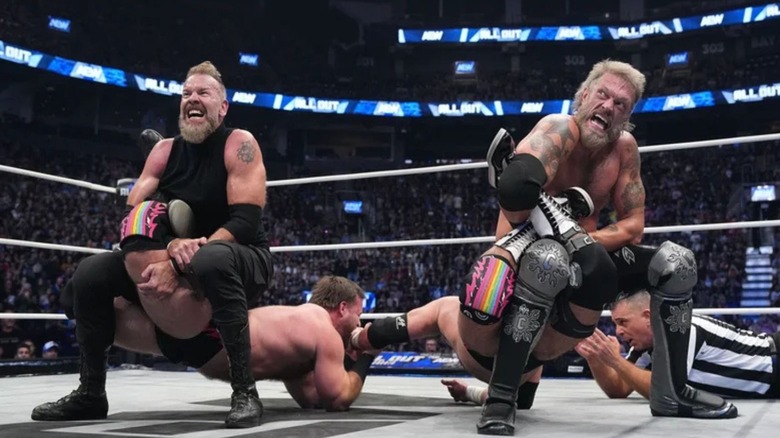 Adam Copeland and Christian Cage put FTR in double sharpshooters in the middle of the ring.