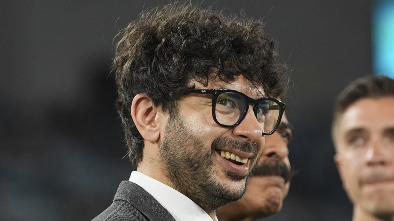 Tony Khan flashes a smile at a Jaguars game