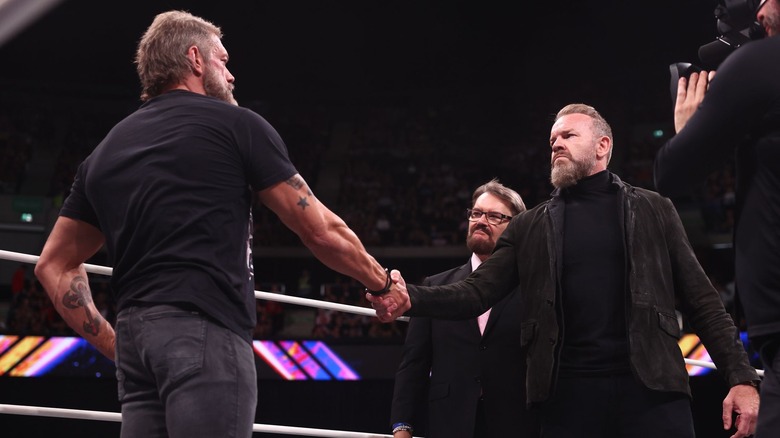 Cope and Christian Cage shake hands