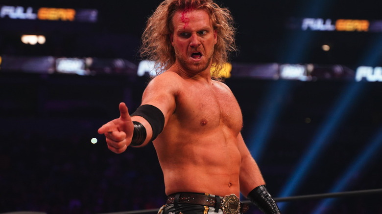 Hangman Adam Page fires a finger gun at Kenny Omega at AEW Full Gear 2025