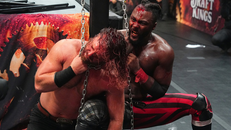 Swerve Strickland chokes out Adam Page with a chain