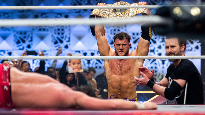 MJF raises his title belt in victory 