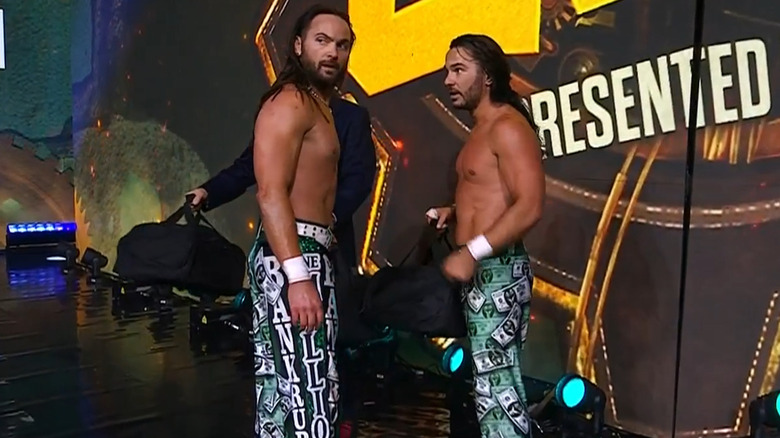 Nick and Matt Jackson considering the bags of money