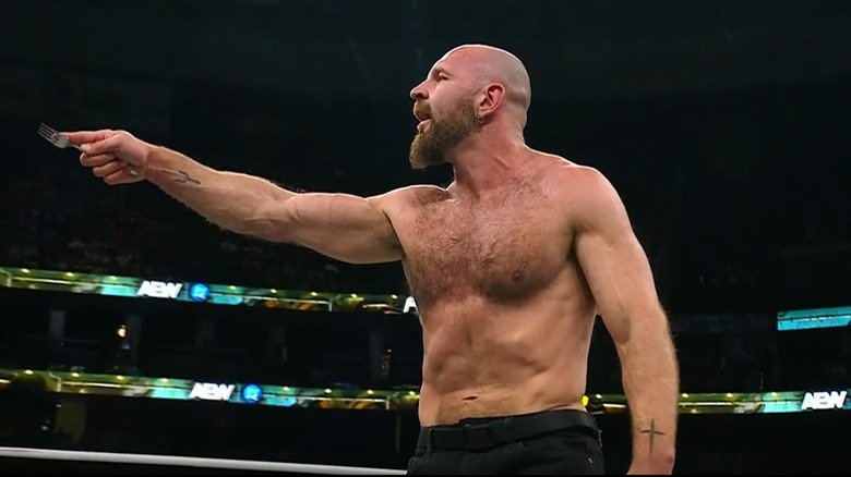 Jon Moxley holding a fork