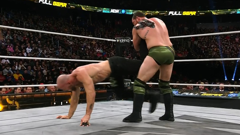Kyle O'Reilly holds Jon Moxley in an ankle lock