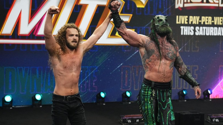 Jurassic Express raise their arms on "AEW Dynamite"