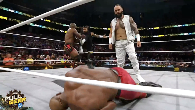 Gates of Agony standing over Lashley and Benjamin