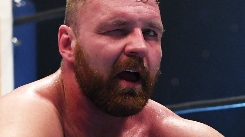 Jon Moxley sitting in the ring
